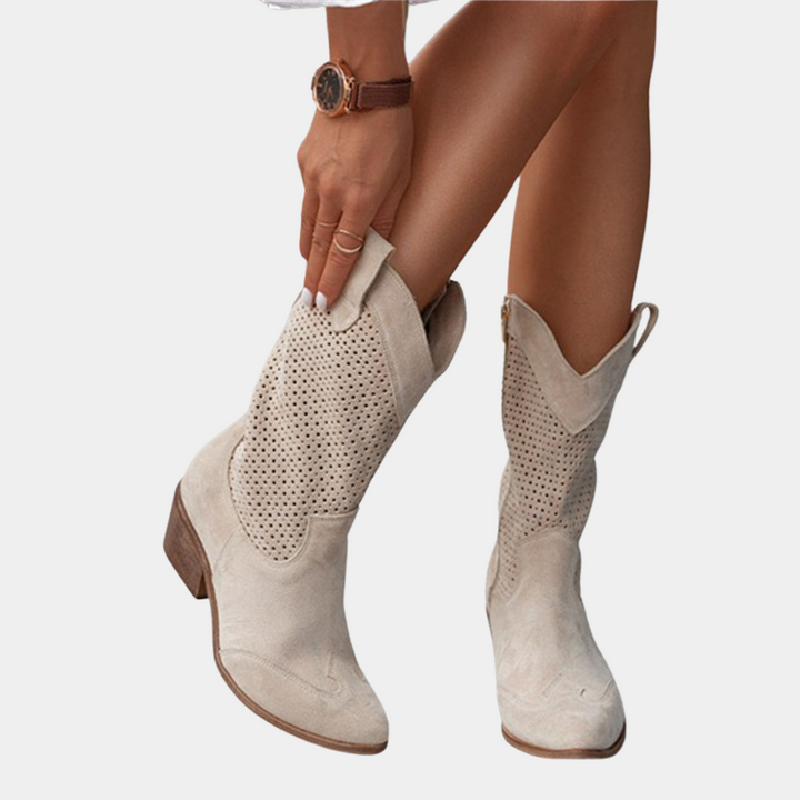 Sophisticated women's mid-calf boots with a stable block heel and detailed perforated design. Stylish & comfy.