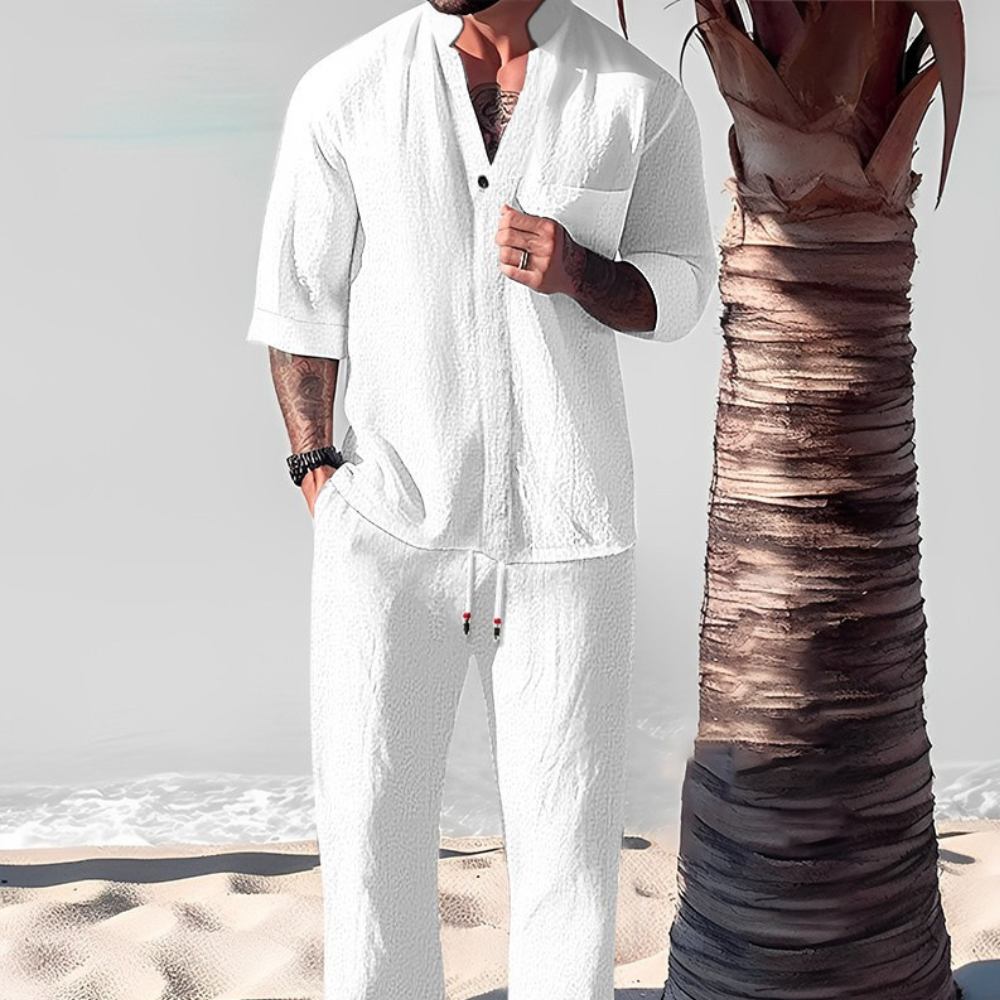 Men's casual two-piece vacation outfit with a relaxed shirt and comfortable trousers for summer style.