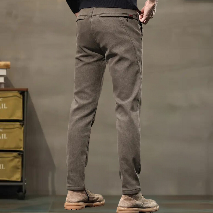 Comfortable men's stretch pants, slim fit & tapered for a smart, modern look. Ideal for office or casual settings.
