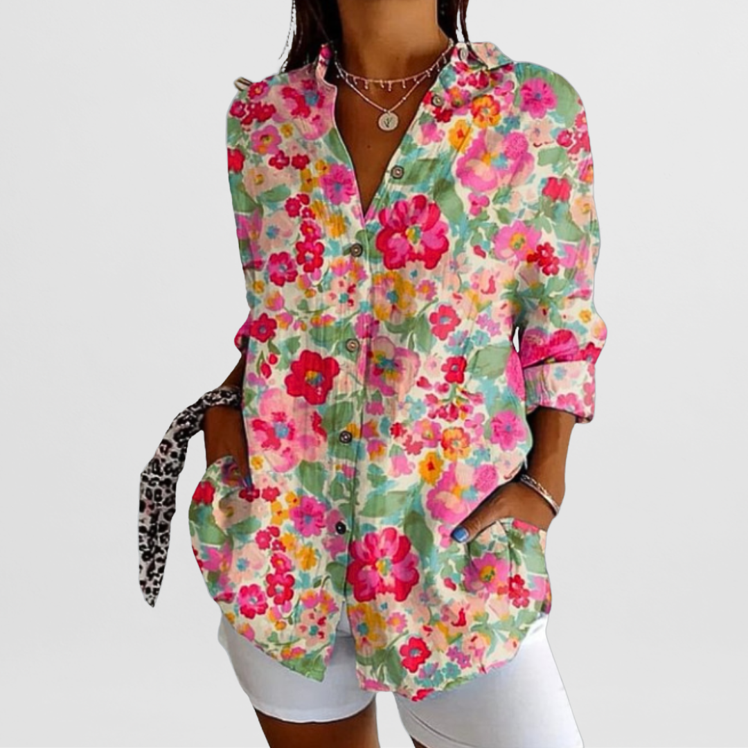 Effortless ladies' tropical floral print blouse. Loose fit, long sleeve, button front for elegant casual wear.