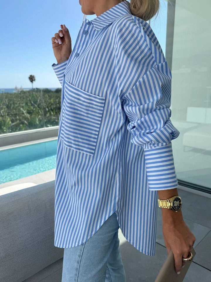 Classic striped button-up shirt for women, featuring a crisp collar and comfortable, casual style.