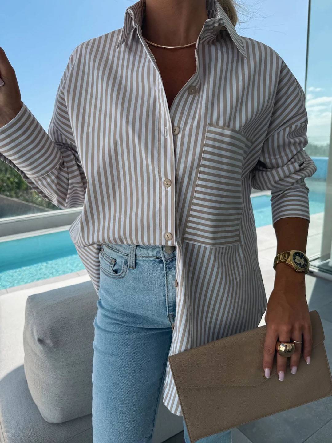 Plus size women's striped button-up blouse, a comfortable long-sleeve top for an effortlessly chic look.