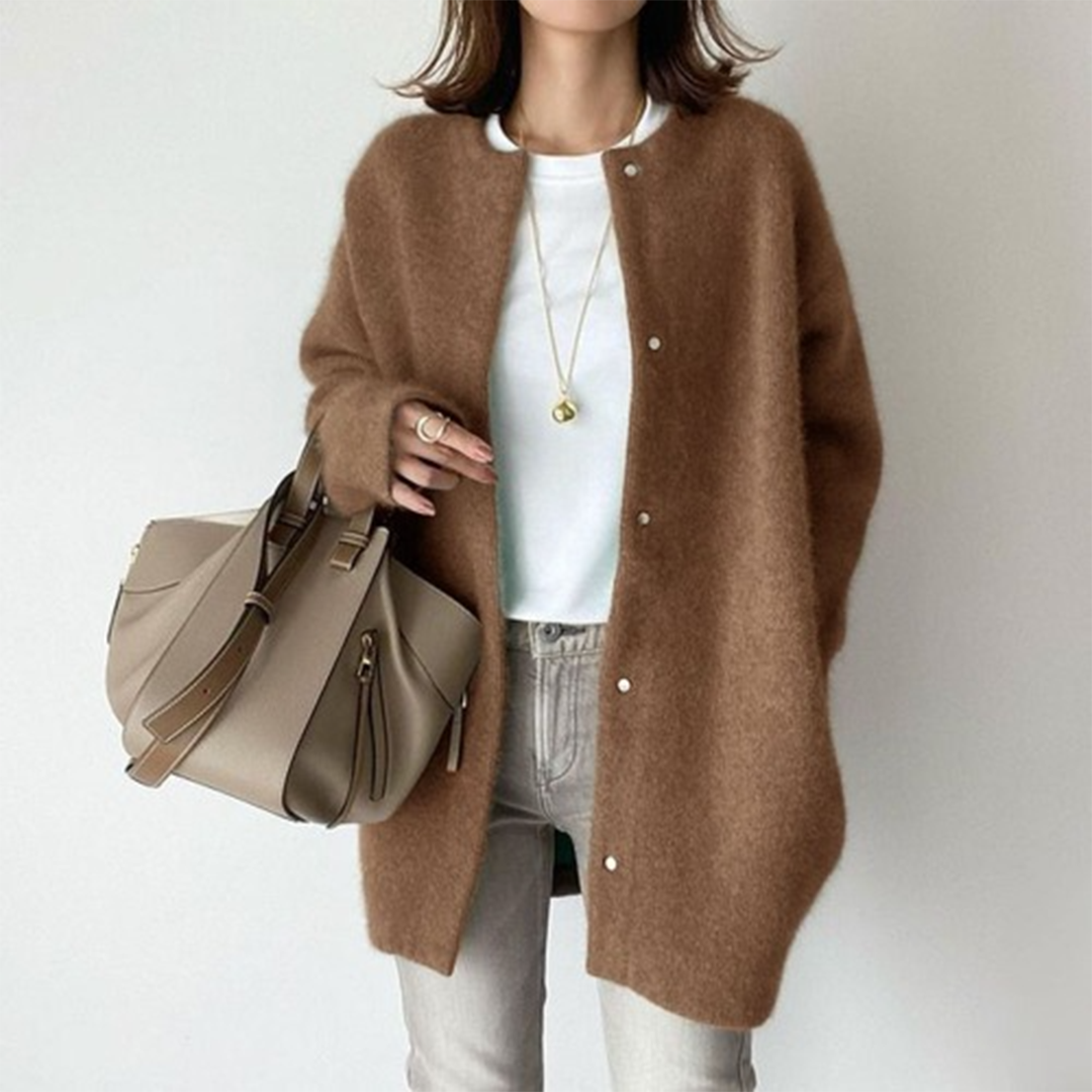 Soft knit women's longline button cardigan, comfortable relaxed fit & minimalist design for layering.