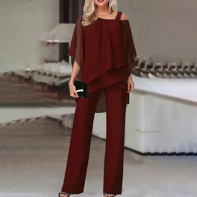Modern women's elegant 2-piece jumpsuit. Features off-shoulder design & chiffon fabric, great for parties.