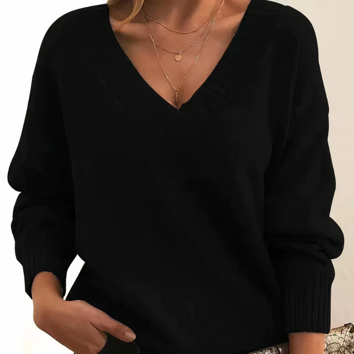 Women's elegant V-neck pullover sweater, soft knit for cozy chic fall & winter style. Long sleeve top.