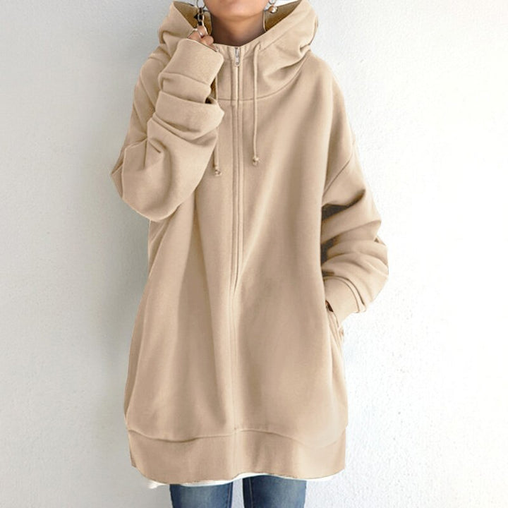 Close-up of soft fabric on a women's cozy oversized hoodie, ideal for ultimate winter warmth and comfort wear.