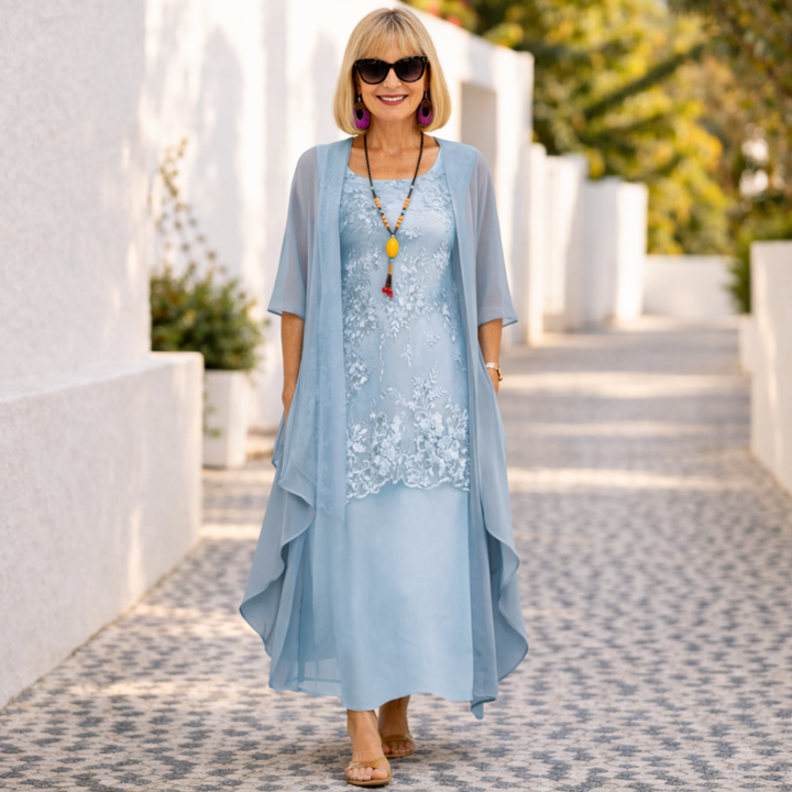 Women's elegant knee-length dress with a flattering smocked waist and round neck, versatile for summer.