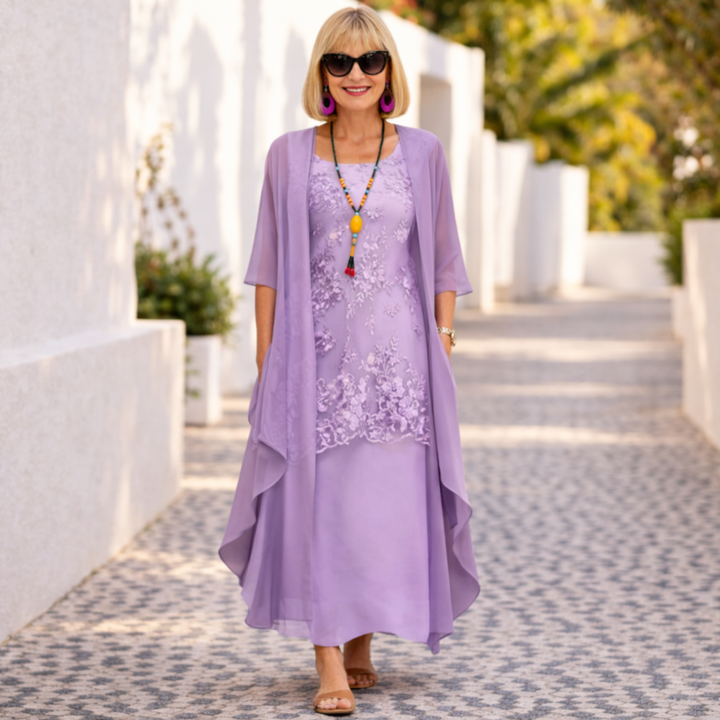 Elegant women's summer dress, knee-length, featuring a flattering smocked waist and classic round neck design.