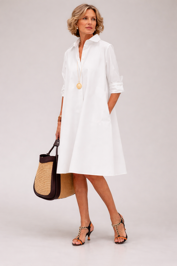 Women's elegant A-line midi shirt dress with button front & collar, perfect for timeless spring/summer style.