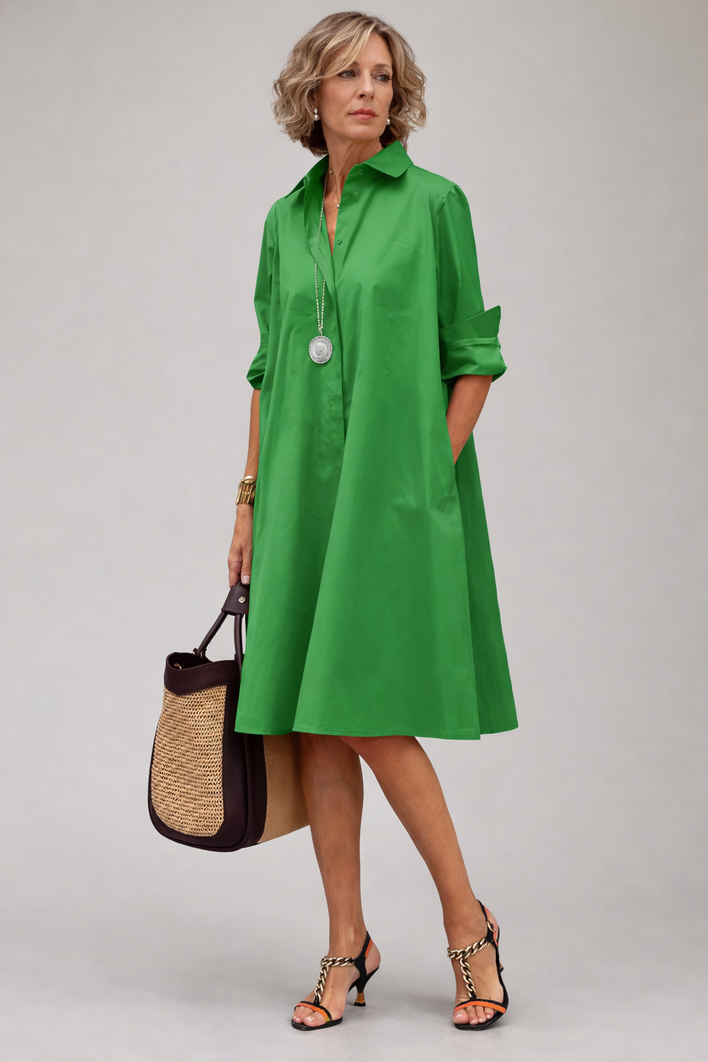 Timeless women's elegant A-line midi shirt dress, button-front design for sophisticated everyday wear.
