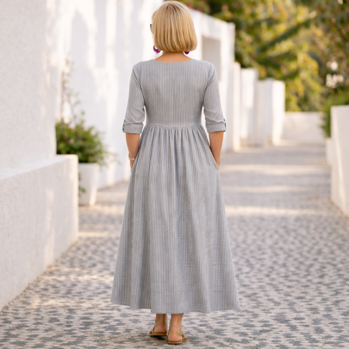 Versatile blue women's midi dress with an elegant asymmetric neckline & fitted waist, great for various occasions.