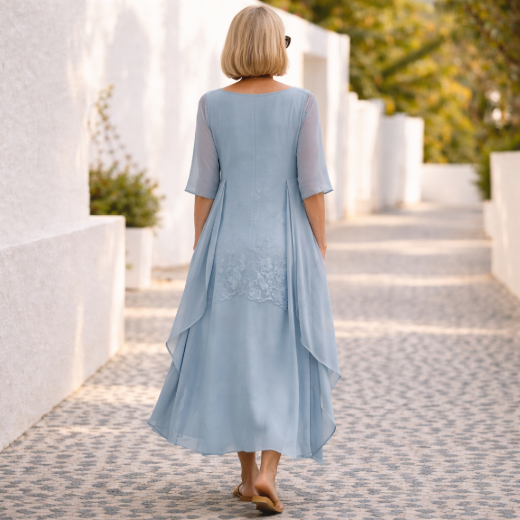 Casual yet elegant women's summer dress, knee-length with a comfortable smocked waist and round neck.