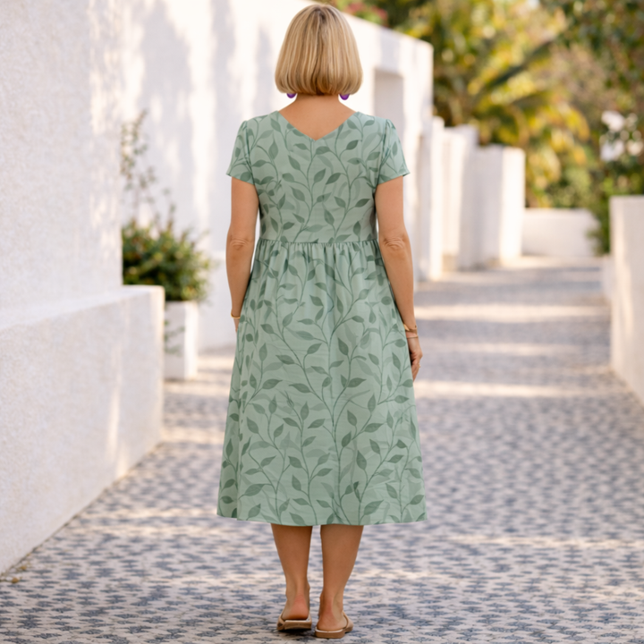 Comfortable women's sleeveless v-neck midi dress featuring an elegant leaf print for summer casual wear.