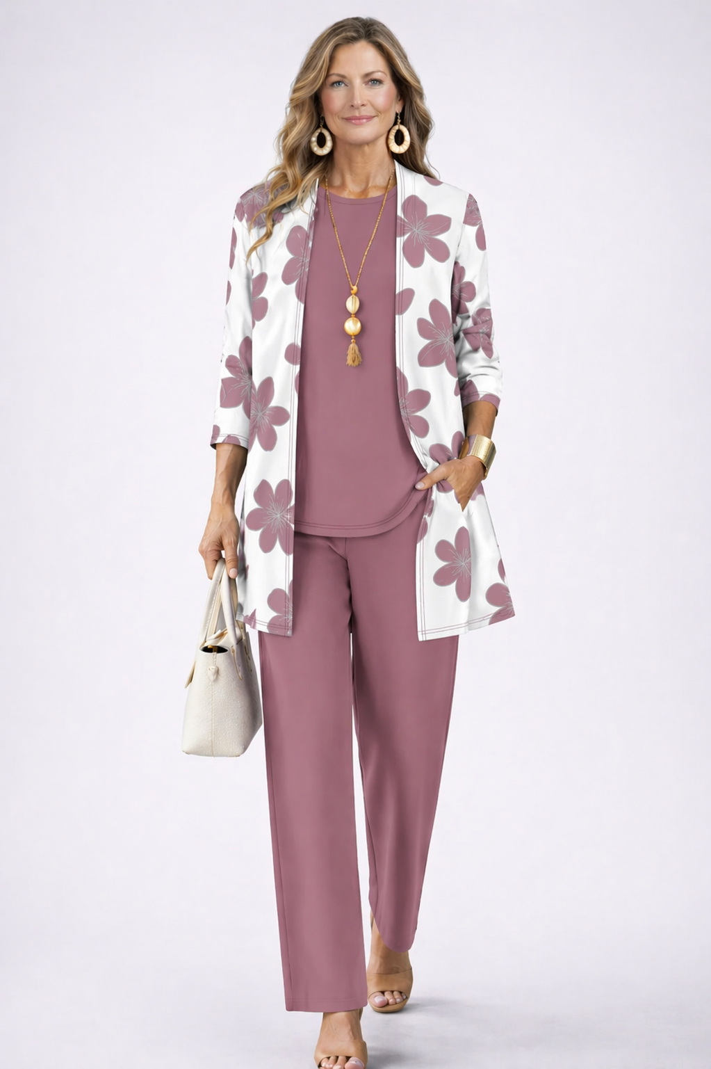 Women's elegant Twilight Pink 3-piece loungewear set featuring a relaxed fit cardigan, matching top, & wide-leg pants.