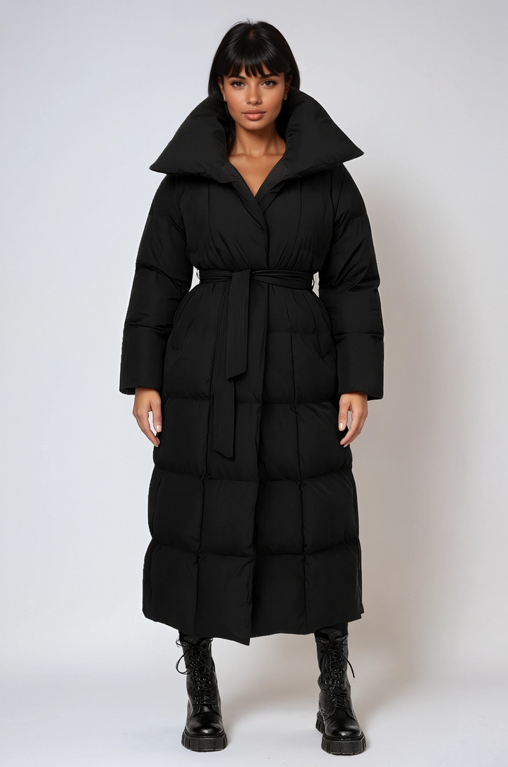 Elegant long quilted winter coat for women, perfect for cold weather and sophisticated style.