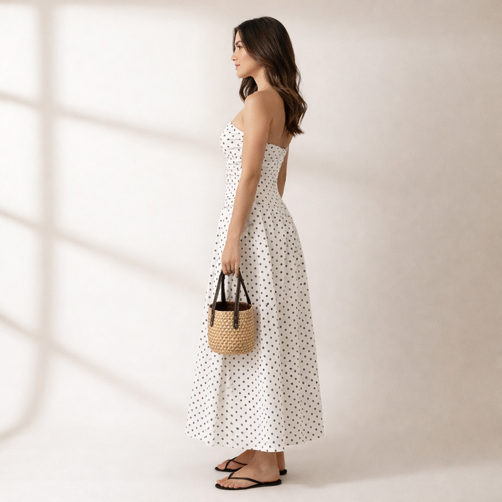Flowy women's strapless polka dot maxi dress. Timeless design, ideal for elegant summer & vacation wear.