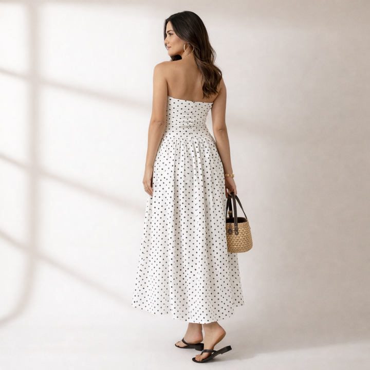 Chic women's strapless polka dot maxi dress for summer, vacation, or evening parties. Elegant casual fashion.