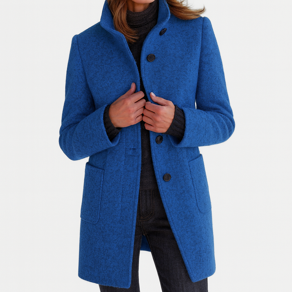 Close-up of button front on a women's straight cut mid-length coat, minimalist design, versatile jacket.