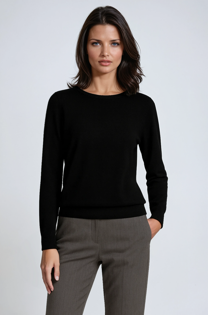 Elegant women's knitwear jumper with long sleeves. Comfortable round neck pullover for smart casual winter fashion.