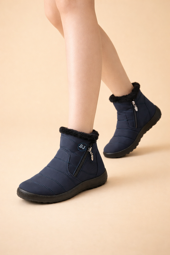 Fashionable ladies' snow boots, waterproof and non-slip, ensuring warmth and grip for winter activities.