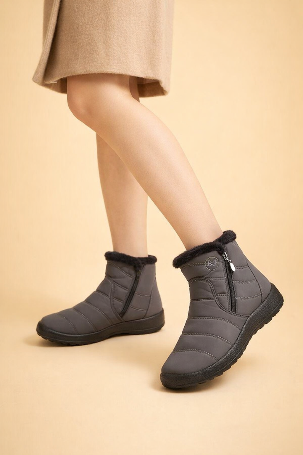 Warm women's snow boots with side zip, featuring a non-slip sole for secure winter outdoor adventures.