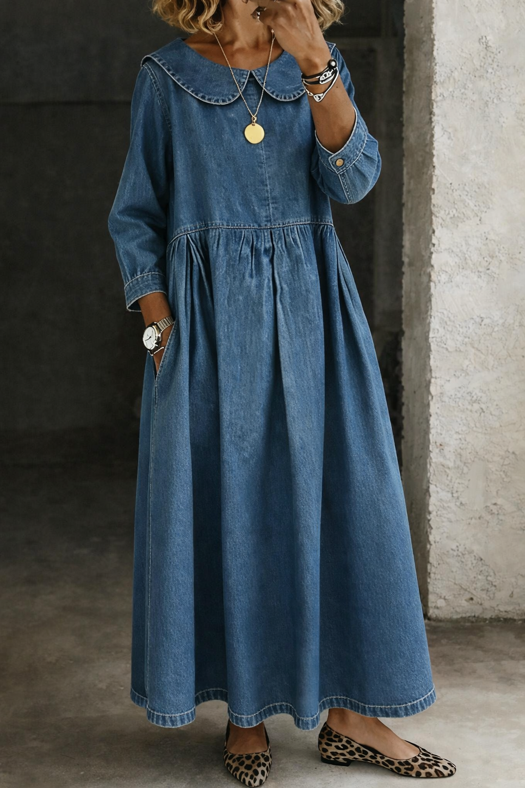 Women's elegant A-line maxi dress with long sleeves & classic Peter Pan collar.