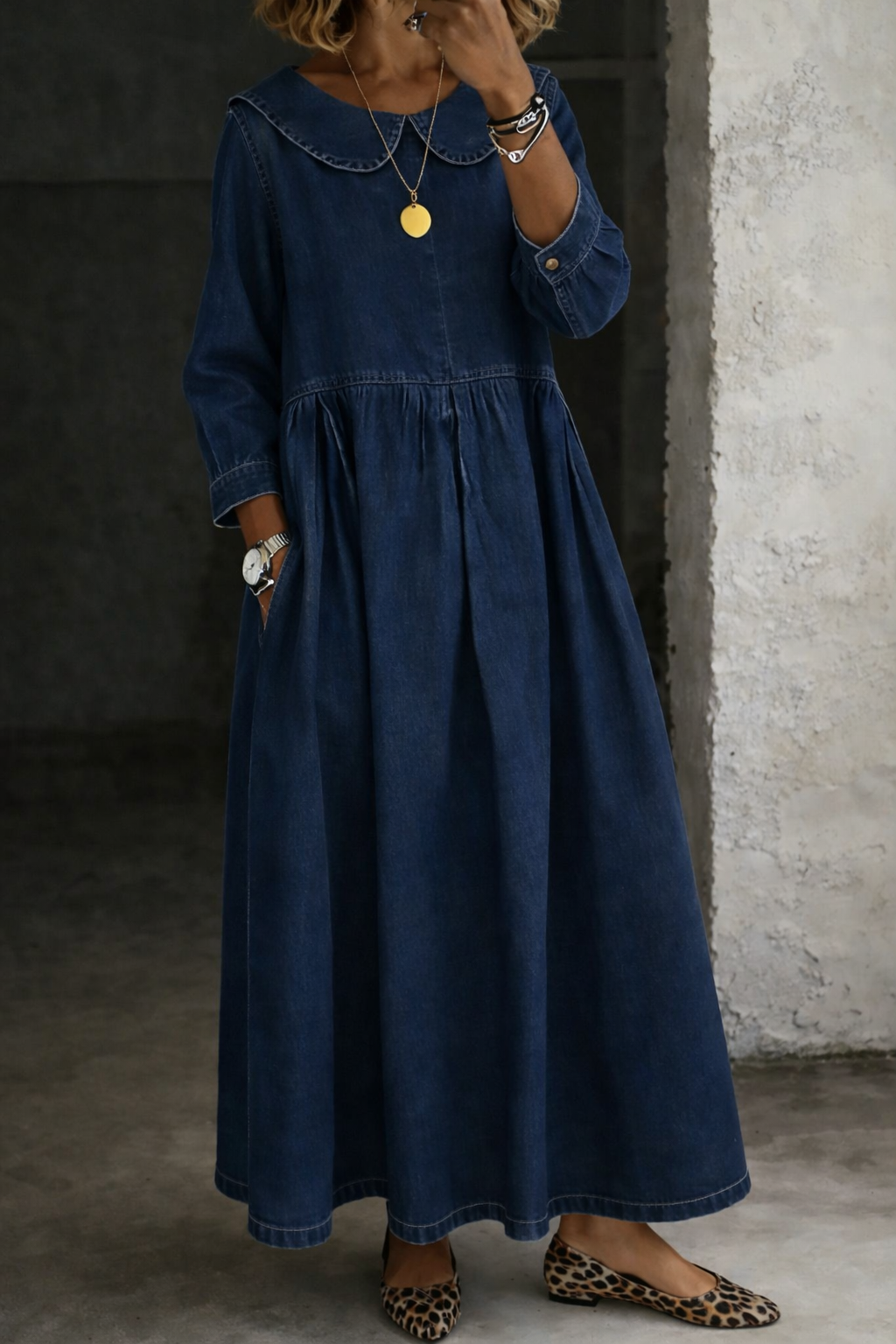 Women's A-line maxi dress featuring a chic Peter Pan collar, gathered waist, and practical pockets.