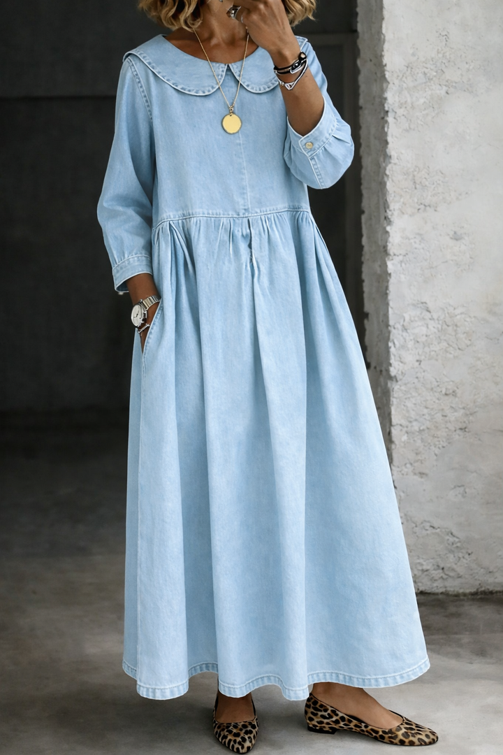 Close-up of elegant Peter Pan collar and gathered waist detail on a women's maxi dress.