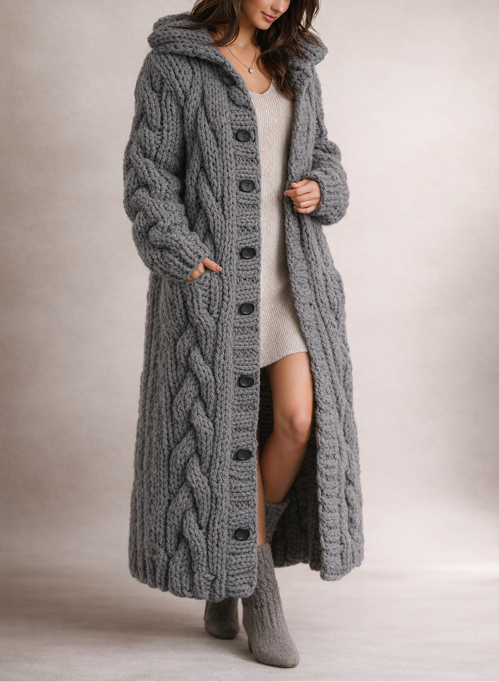Elegant women's cozy cable knit coat, flattering fit with tummy coverage, perfect for fall and winter style.