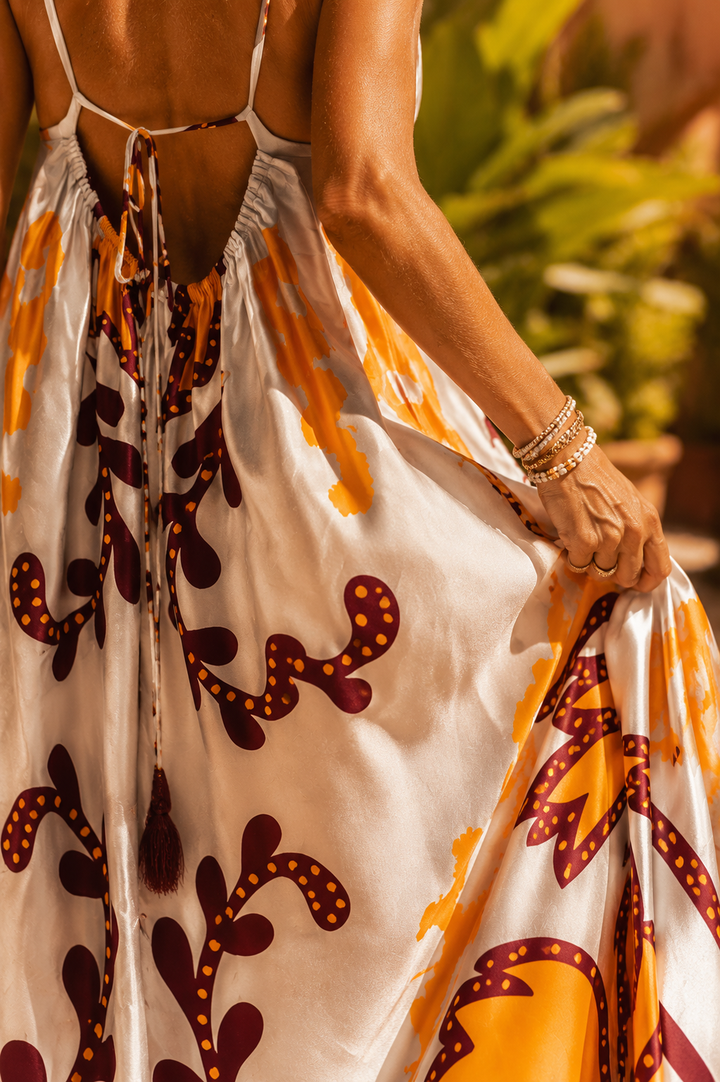 Vibrant orange elegant women's maxi dress, perfect as a summer holiday dress or a sophisticated evening gown.