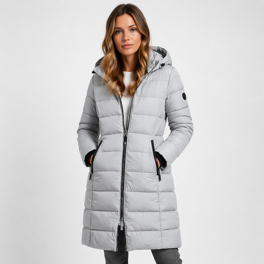 Stylish women's hooded puffer jacket. Mid-thigh length, quilted, zip-front closure. Versatile winter outerwear for casual wear.