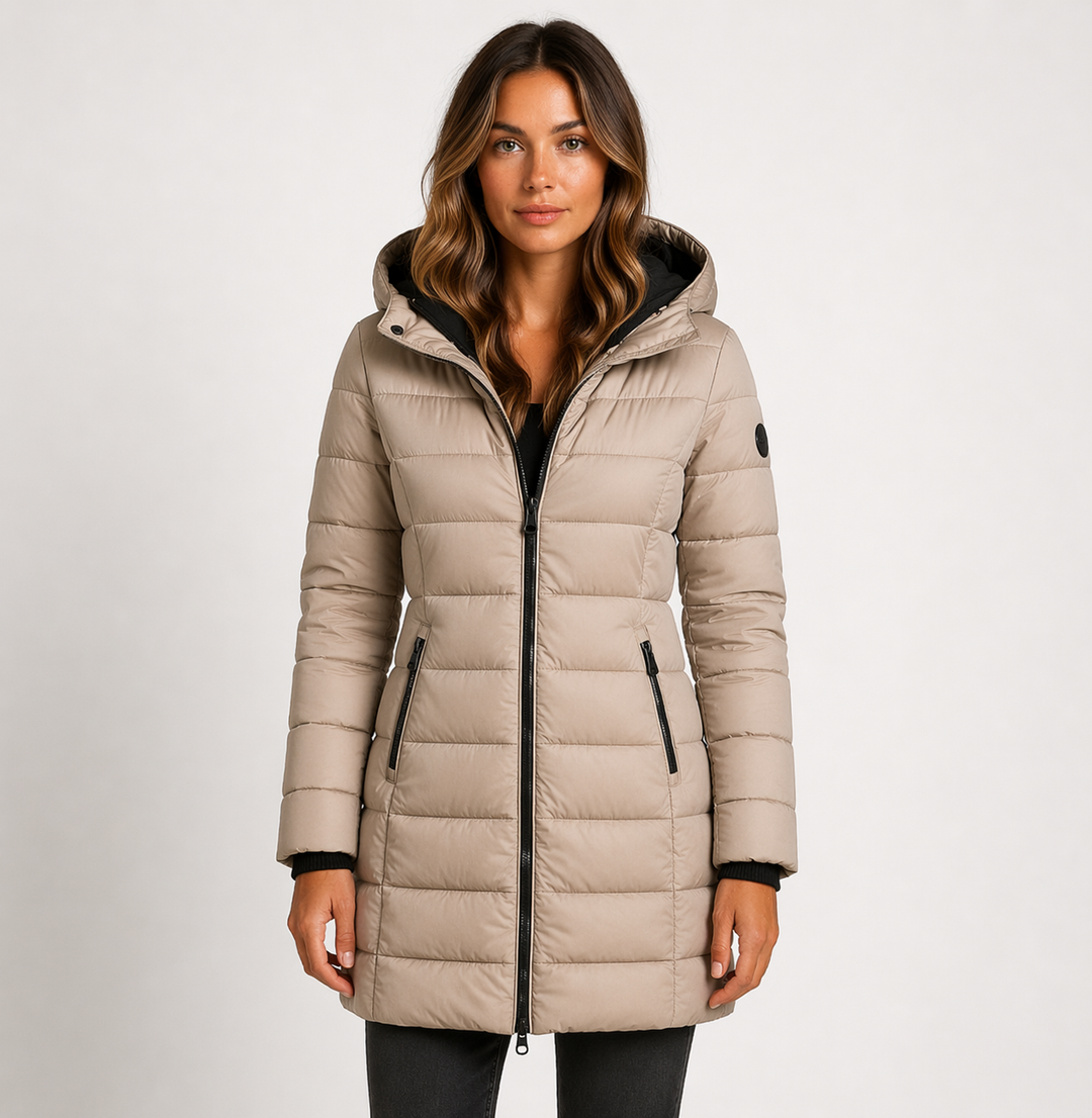 Warm women's puffer jacket with hood. Quilted, mid-thigh design ensures comfort in cold weather. Essential winter fashion.