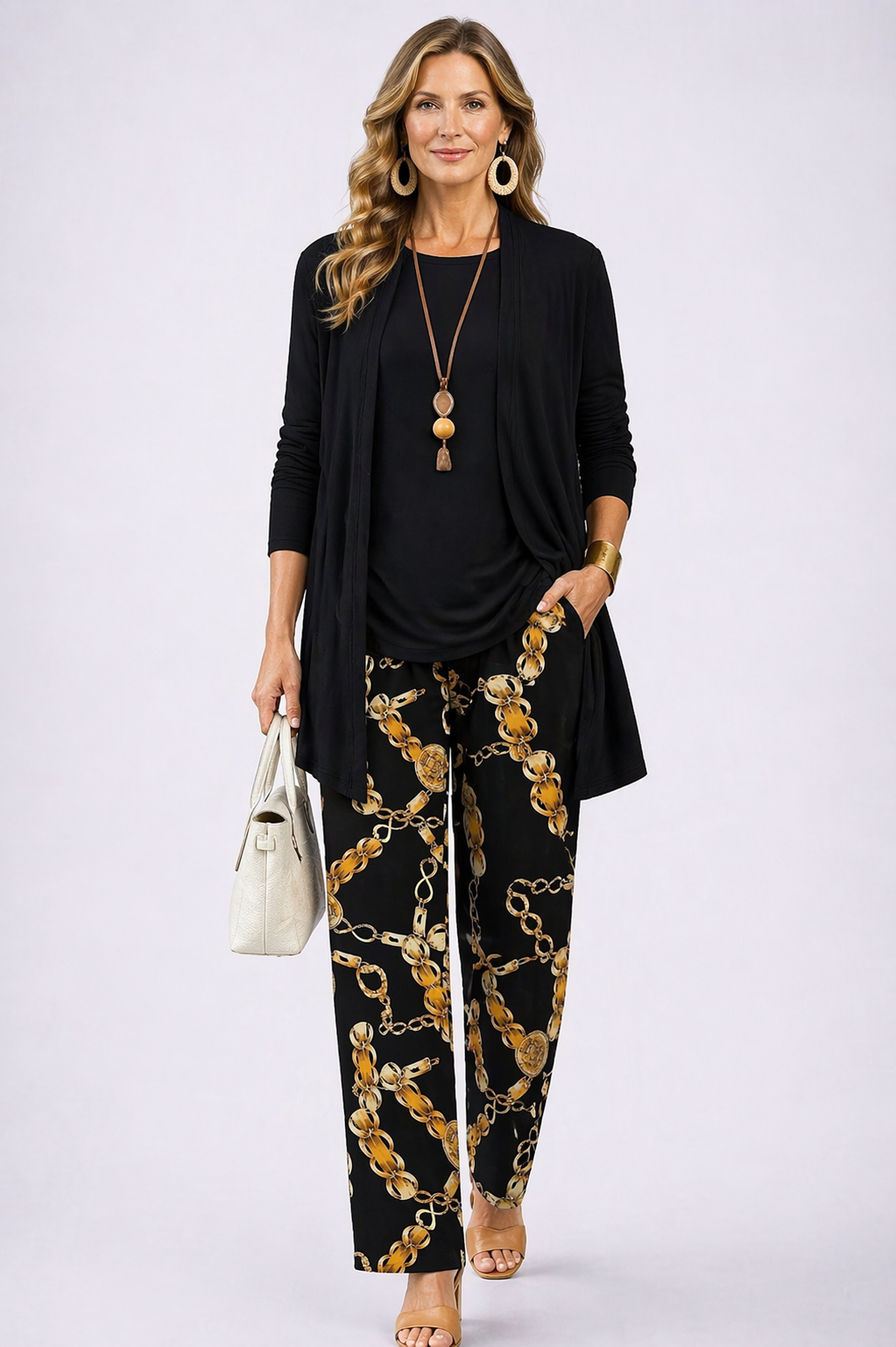 Women's relaxed black 3-piece loungewear set with wide-leg trousers & long-sleeve top. Casual, comfortable, plus-size fashion.