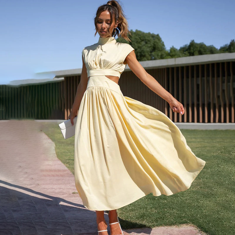 Flattering women's pleated midi dress with cap sleeves. Solid color and flowy design for an elegant, versatile look.