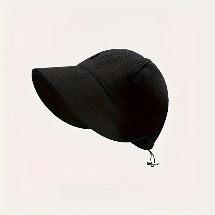 Fashionable women's sun hat with UPF protection. Features an adjustable drawstring for stylish, secure summer wear.