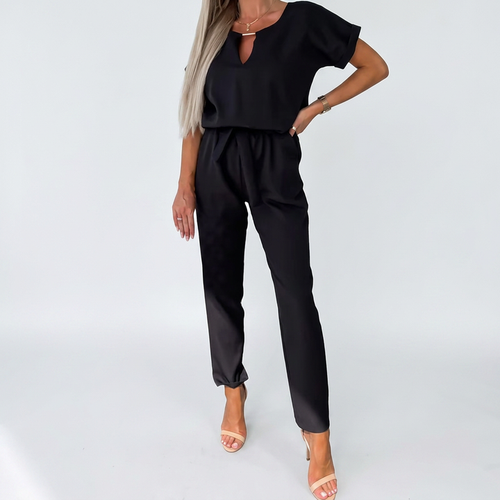Modern women's elegant short-sleeve keyhole neck jumpsuit, ideal versatile fashion for work or evening events.