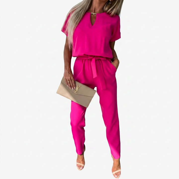 Chic women's short-sleeve jumpsuit featuring an elegant keyhole neck, perfect for sophisticated office & dinner outfits.