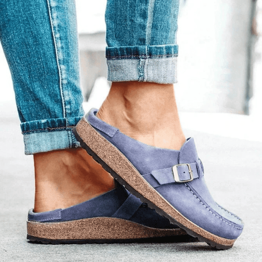 Comfortable women's ergonomic flats featuring a supportive cork sole & stylish moc toe design.