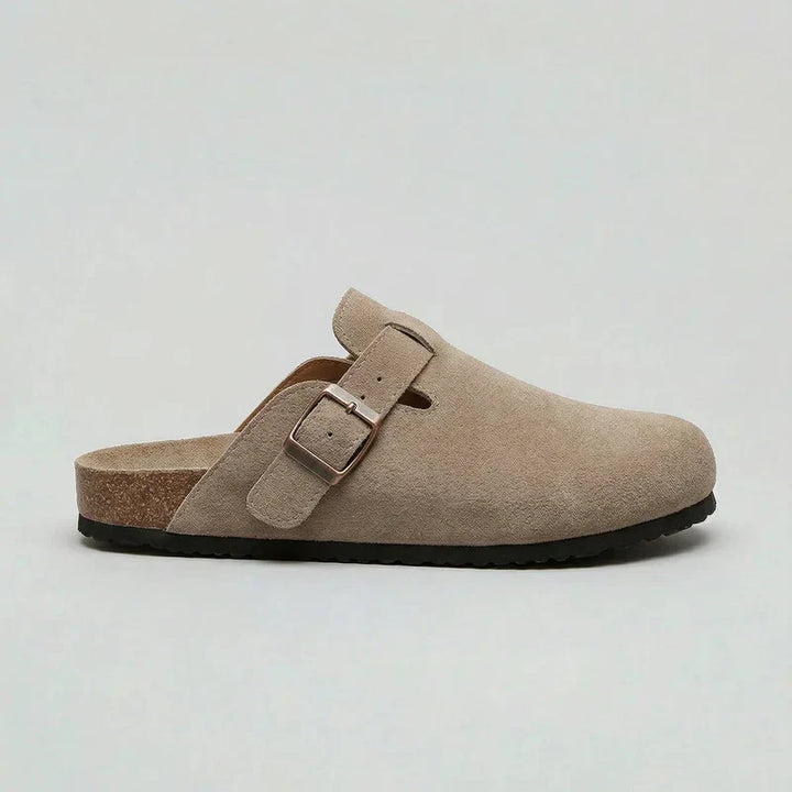 Beige unisex comfort clogs with an adjustable buckle strap, ideal for casual everyday slip-on footwear.