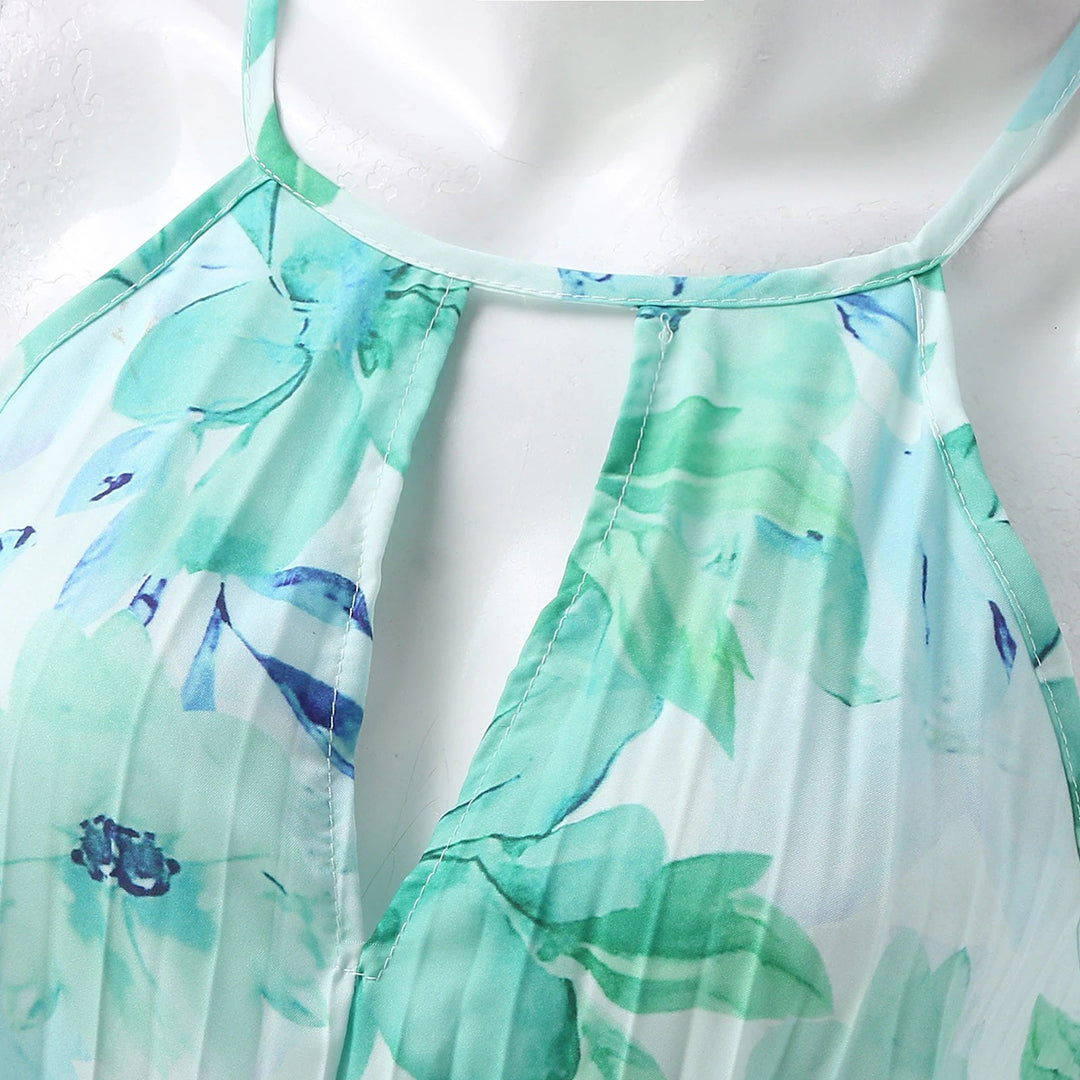 Women's green floral maxi dress featuring a comfortable, flowy design for elegant summer style. Beach to party.