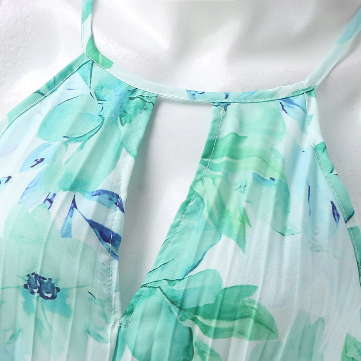 Women's green floral maxi dress featuring a comfortable, flowy design for elegant summer style. Beach to party.