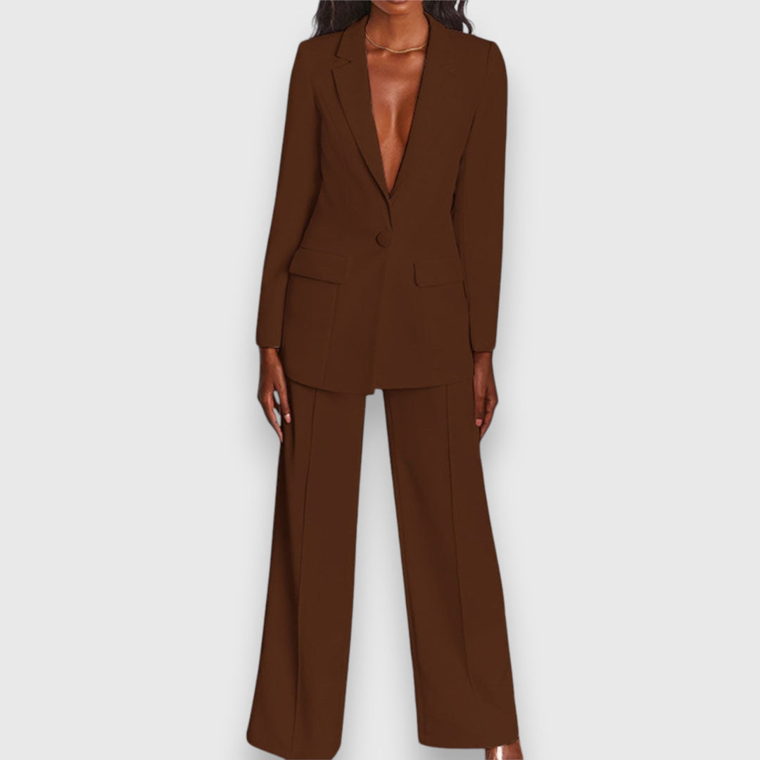 Navy women's two-piece blazer & trousers set. Elegant & professional office wear fashion.