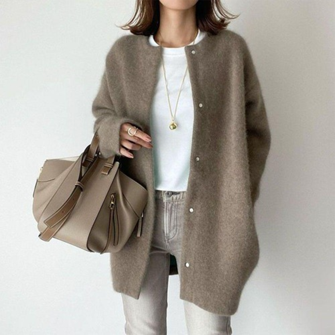 Chic women's button-front longline cardigan, minimalist style for easy layering & comfortable relaxed fit.
