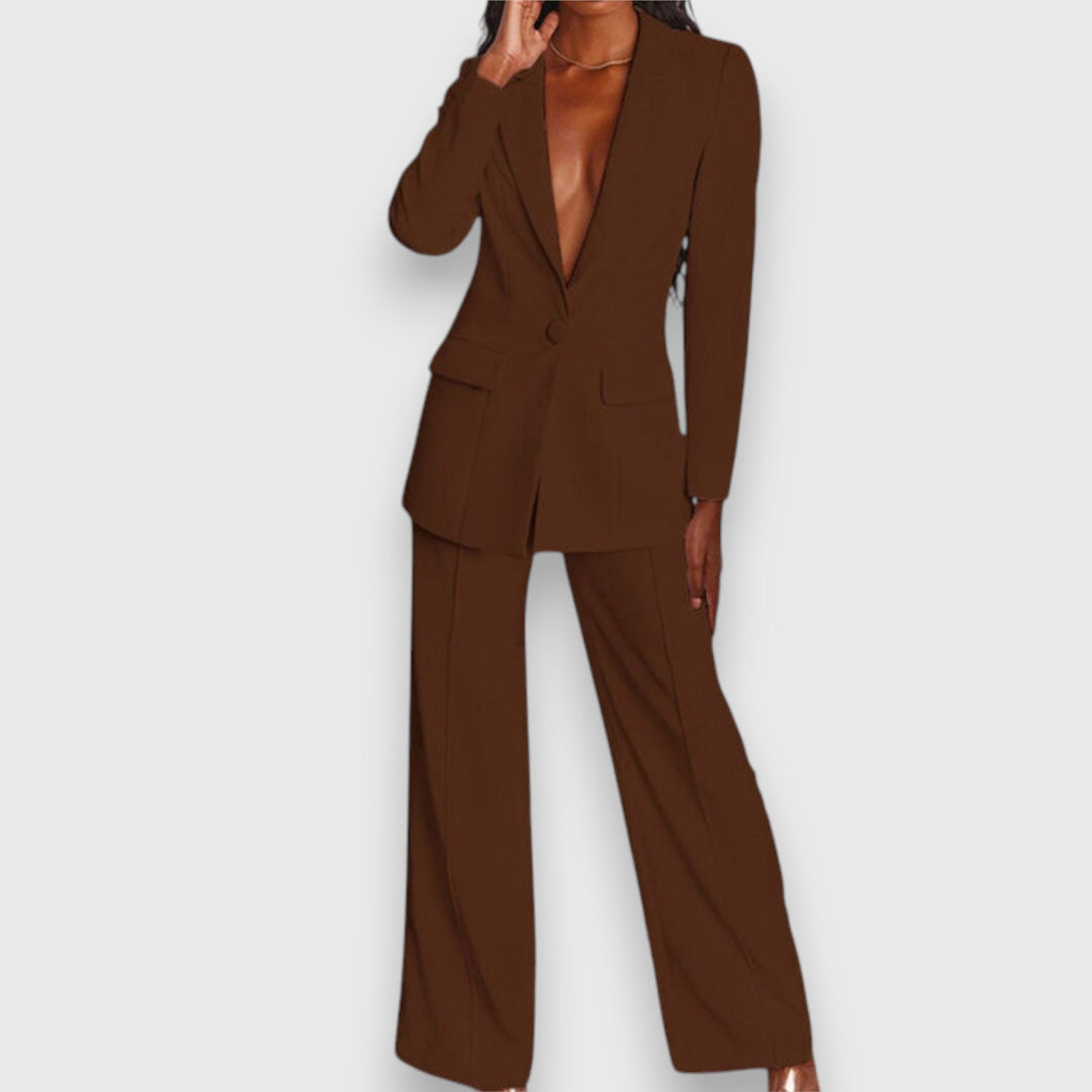 Tailored women's elegant two-piece set: structured blazer & sleek trousers. Formal fashion.