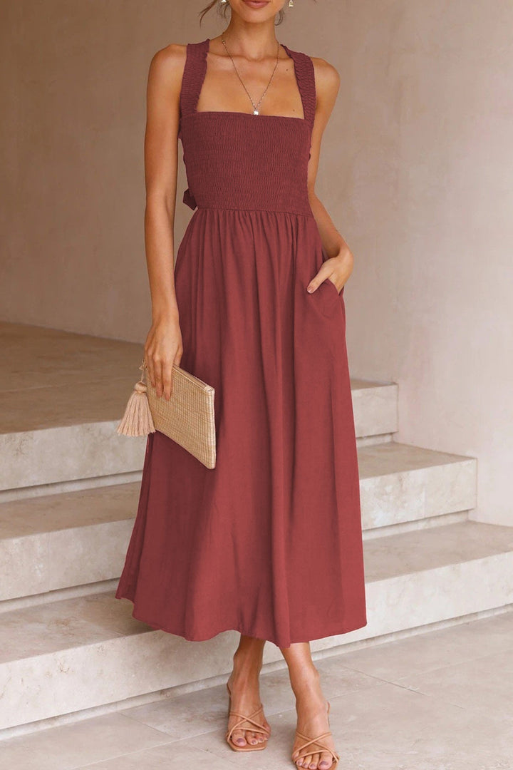 Beautiful women's crisscross tie-back midi dress, perfect for a stylish summer look.