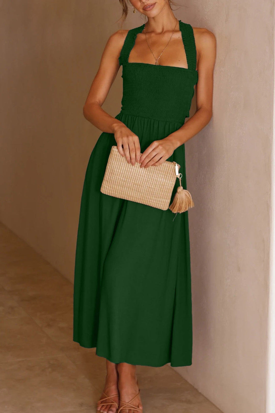 Model wearing a women's elegant crisscross tie-back midi dress, perfect for chic summer fashion.