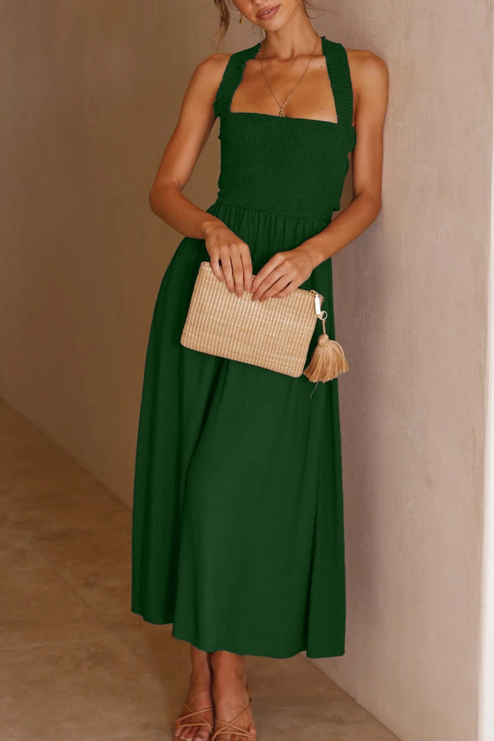 Model wearing a women's elegant crisscross tie-back midi dress, perfect for chic summer fashion.