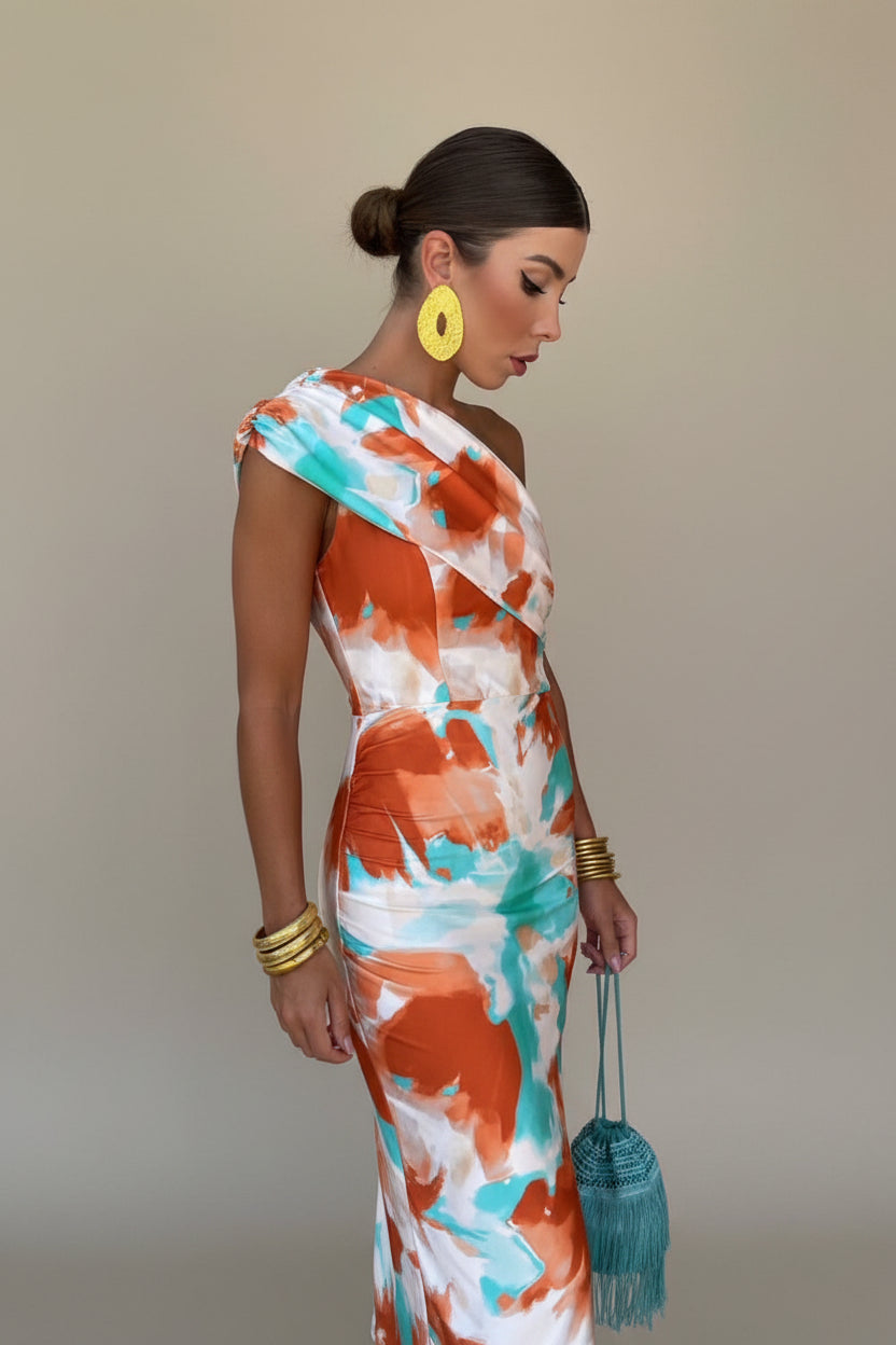 Joyful vibrant colorful summer dress for women, ideal as a party dress or elegant vacation wear.