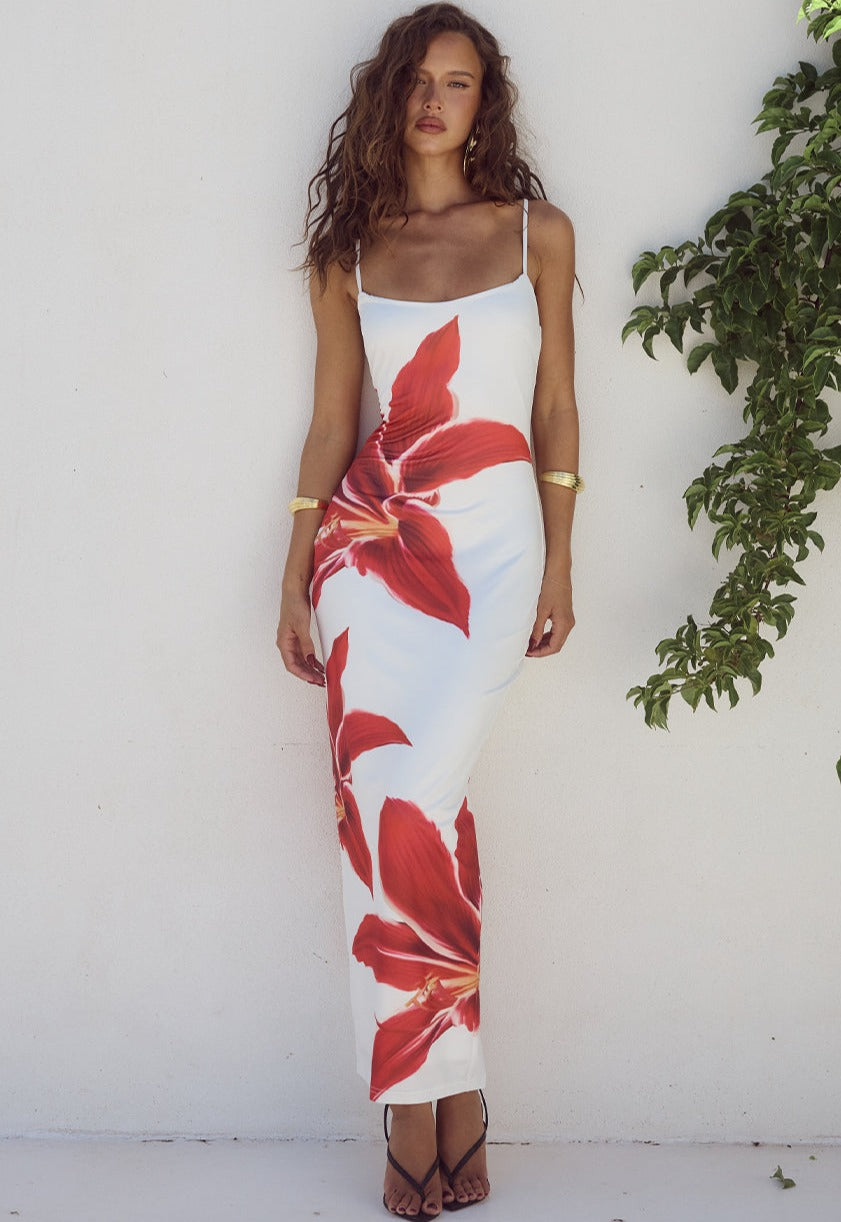 Elegant floral midi dress for women, perfect for summer occasions. Adjustable straps & feminine style.