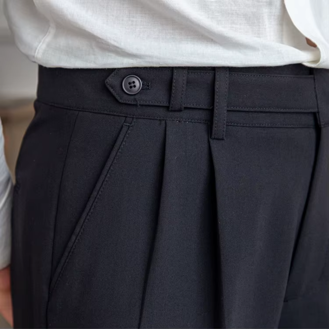 Men's elegant pleated chino trousers, a tailored and sophisticated menswear piece.